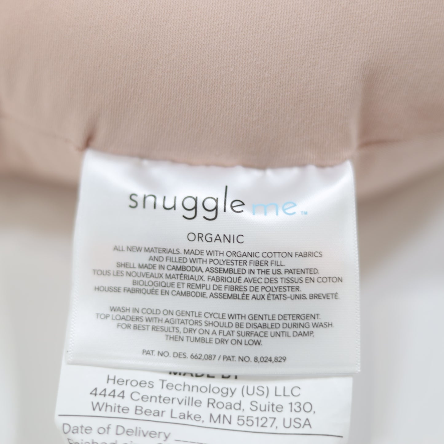 Snuggle Me Organic logo tag on Petal lounger – premium organic baby product