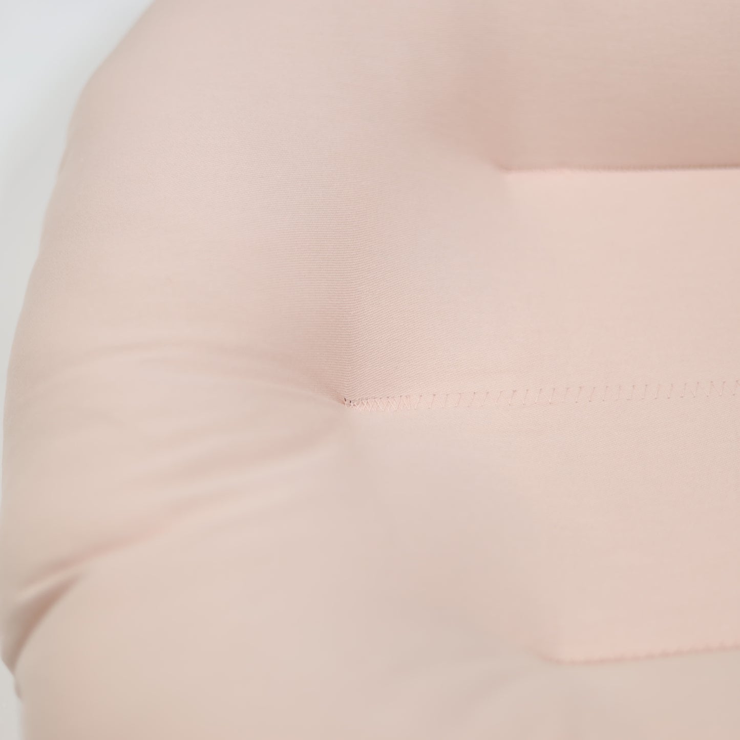 Close-up of Petal pink Snuggle Me Organic lounger fabric – soft and hypoallergenic