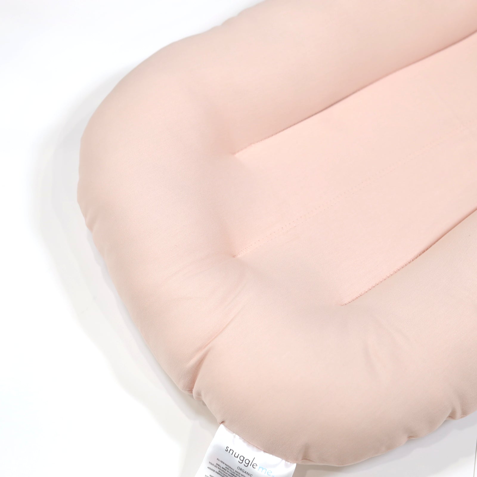 Side view of Snuggle Me Organic Lounger Petal – breathable newborn baby nest
